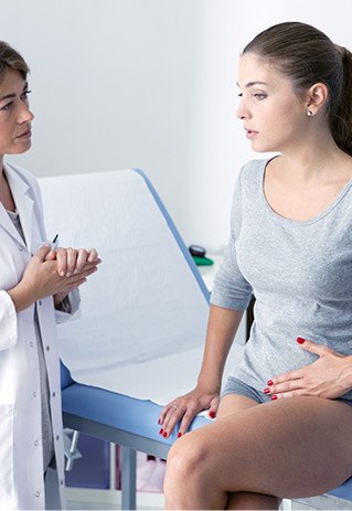Woman consulting with doctor